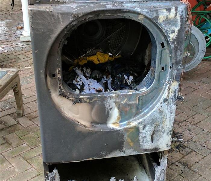 A burned and melted clothes dryer 