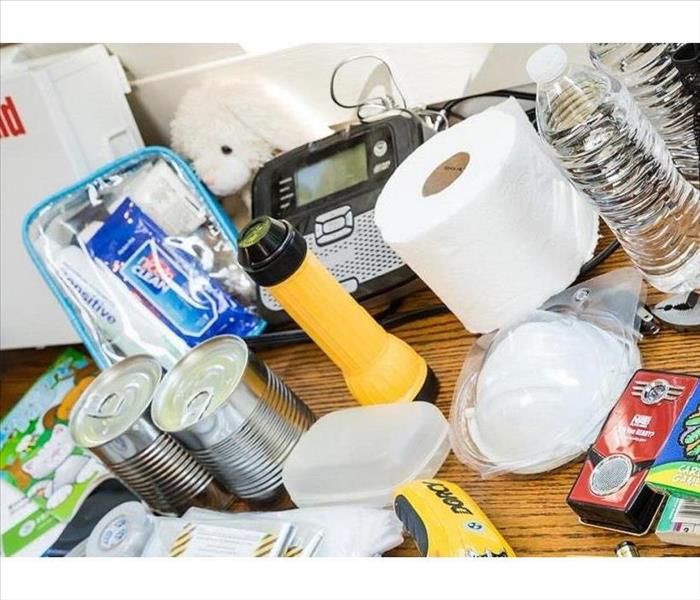 An array of items laid out to fill an emergency bag 
